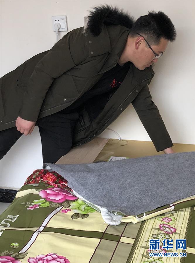 （新春走基層&middot;圖文互動(dòng)）（3）班彥村&ldquo;冬天最幸福的事&rdquo;：用上&ldquo;電熱炕&rdquo; 告別煤煙味 