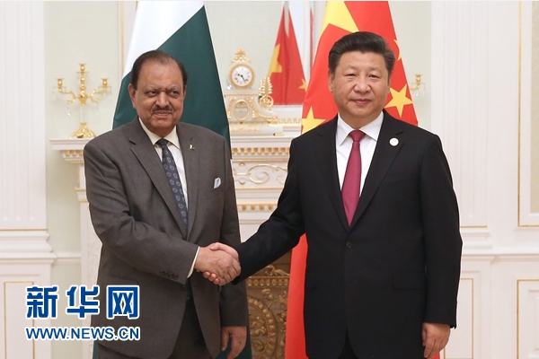 6月23日，國家主席習近平在塔什干會見巴基斯坦總統(tǒng)侯賽因。新華社記者馬占成攝